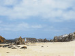 © Walkerpod Images/Tetra Images - Australia, New South Wales, Bermagui, Woman walking along sandy beach