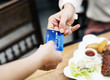 © Rawpixel.com - Woman paying lunch with credit card at restaurant
