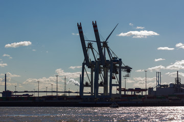 hamburg elbbruecken named river bridges container terminal docks boats and ships details and blue sky