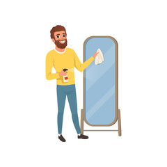 Poster - Young guy cleaning big bathroom mirror with rag and spraying detergent. Man doing housework. Flat vector design