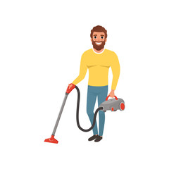 Canvas Print - Cartoon character of smiling man with vacuum cleaner. House husband cleaning floor. Young bearded guy in gray yellow sweater and blue jeans. Flat vector design