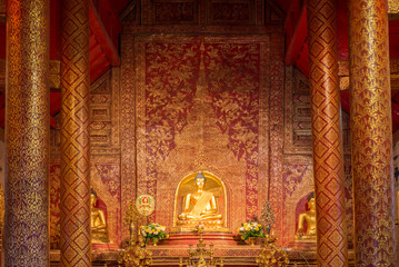 Wall Mural - Buddha image inside the hall in Wat Phra Singh in Chiangmai. Thailand.