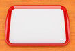 Red plastic food tray with empty liner