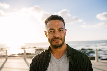 Man on vacation standing near the sea