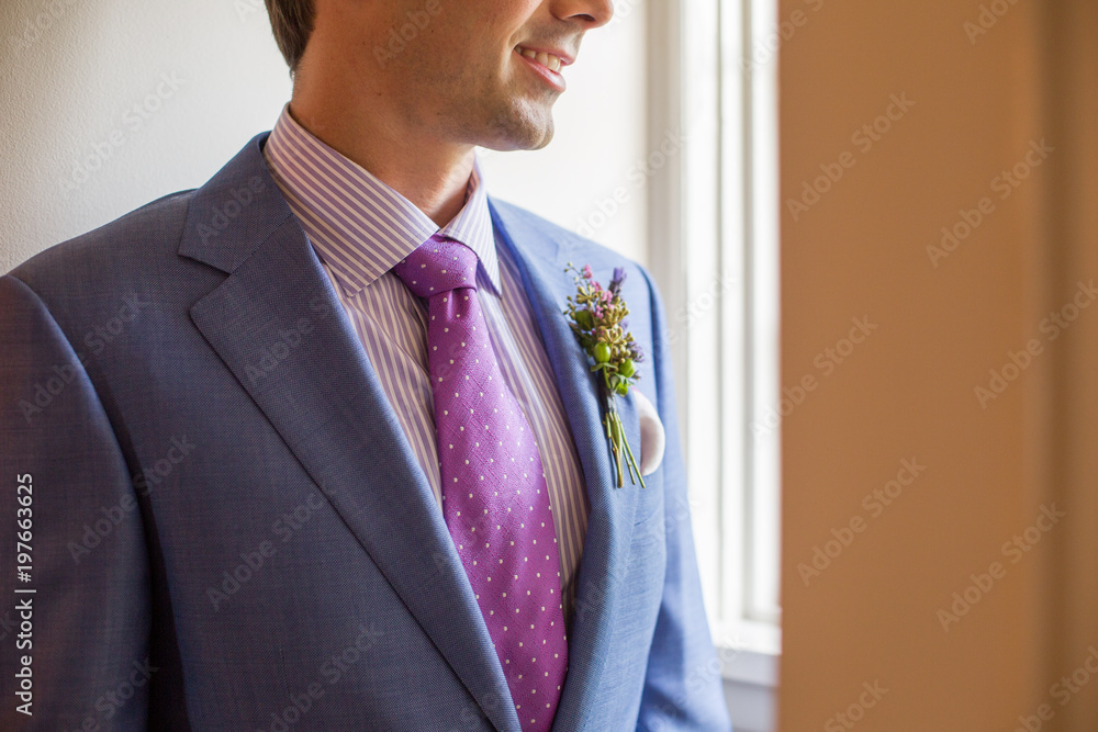 light blue suit purple tie