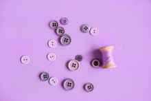 Purple Spool Of Thread With Buttons Different Shades Of Purple On A Purple Background