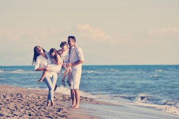 Wall Mural - happy young  family have fun on beach