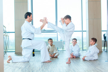 young, beautiful, successful multi ethical kids in karate position