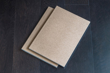 Blank letter-size book, catalog, magazines, brochure, note cover template with recycle brown paper texture on dark wood table