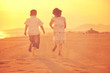 © .shock - happy young family have fun on beach at sunset