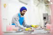© pressmaster - Fish factory staff weighing plastic containers with processed mussels befor epacking