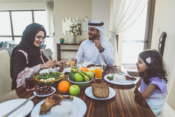 Wall Mural - Arabic happy family lifestyle moments at home