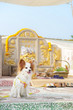 © enchanted_fairy - Cute dog in front of the worship altar at the graveyard of ancestors in the Qing ming Festival in Cemetery. Chinese spiritual belief of the life after death. Dog traveling concept. Papillon pure breed
