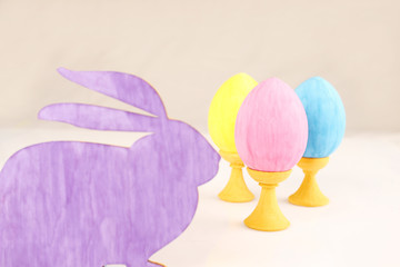  Close-up silhouette of the rabbit with colorful Easter eggs