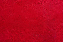 Background Of A Red Stucco Coated And Painted Exterior, Rough Cast Of Cement And Concrete Wall Texture, Decorative Coating