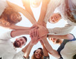 © ASDF - business team with hands clasped together