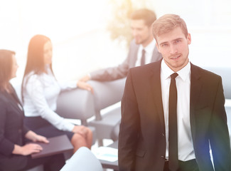 Sticker - portrait of confident businessman on background of office.