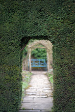 Natural Arch Doorway Entrance In Hedge In Ornamental Garden