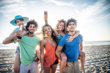 Wall Mural - Friends partying on the beach