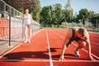 © andrew_shots - A lazy girl is standing and watching her boyfriend go in for sports
