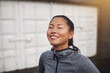 © Flamingo Images - Smiling young Asian woman taking a break from her run