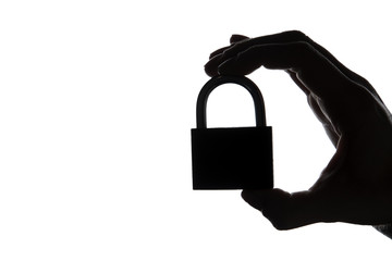 Canvas Print - Silhouette of a hand holding a padlock on a plain white background. Security and privacy.