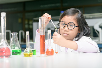 Wall Mural - girl making experiment with test tube