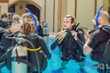 © galitskaya - Diving instructor and students. Instructor teaches students to dive