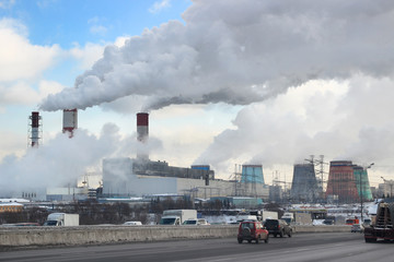 thermal power station. Smoke, steam from industrial pipes, ecology, air pollution. Nuclear power plant.