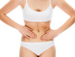 © Jacek Chabraszewski - Woman massaging stomach pain