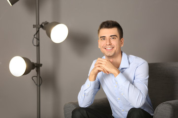 Canvas Print - Portrait of handsome young man indoors