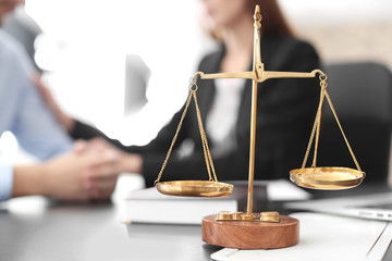 Wall Mural - Scales of justice on table in lawyer's office