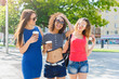© Prostock-studio - Happy girls with take away coffee outdoors
