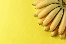 Food Background With Banana Fruit On Yellow Paper.