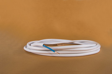 white electrical cable on an orange background