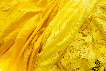 colored crinceld fabric with yellow flower textile background