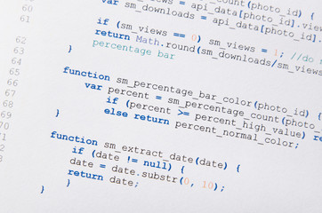 web developer programming code printed on a piece of paper