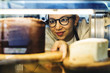 © Rawpixel.com - Woman getting cake out of the display fridge