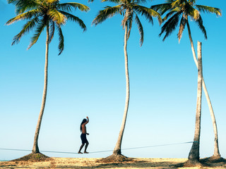 Slacklining, beach, palm tree, sea