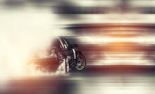 Car Drifting, Sport Car Wheel Drifting And Smoking On Blurred Background.