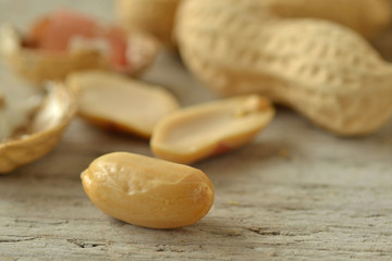 Wall Mural - Macro of peanuts on wooden background