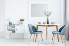 Small dining table with upholstered chairs
