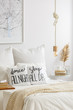 © Photographee.eu - Bed with quote print pillows