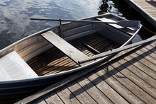 Docked Metal And Wooden Boat On Water
