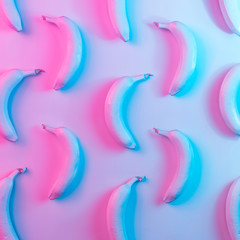 Wall Mural - Banana pattern in vibrant bold gradient holographic neon  colors. Concept art. Minimal surrealism background.