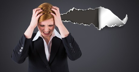 Wall Mural - Stressed and upset woman with torn paper