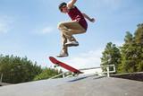 teenagerr jumping  on skateboard