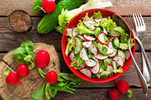 Vegetarian Vegetable Salad Of Radish, Cucumbers, Lettuce Salad And Flax Seeds. Healthy  Vegan Food. Top View