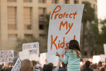 Little Girl Holding A "Protect My Kids" Sign At The March For Our Lives Rally 