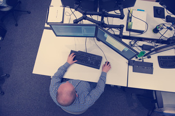 Wall Mural - young programmer writing programming code top view